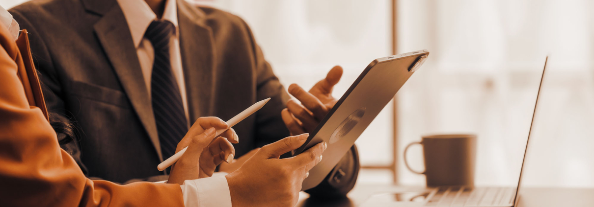 Two business people looking at tablet
