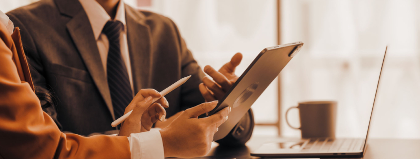 Two business people looking at tablet