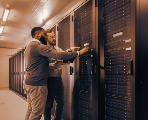 Two professionals working in data center
